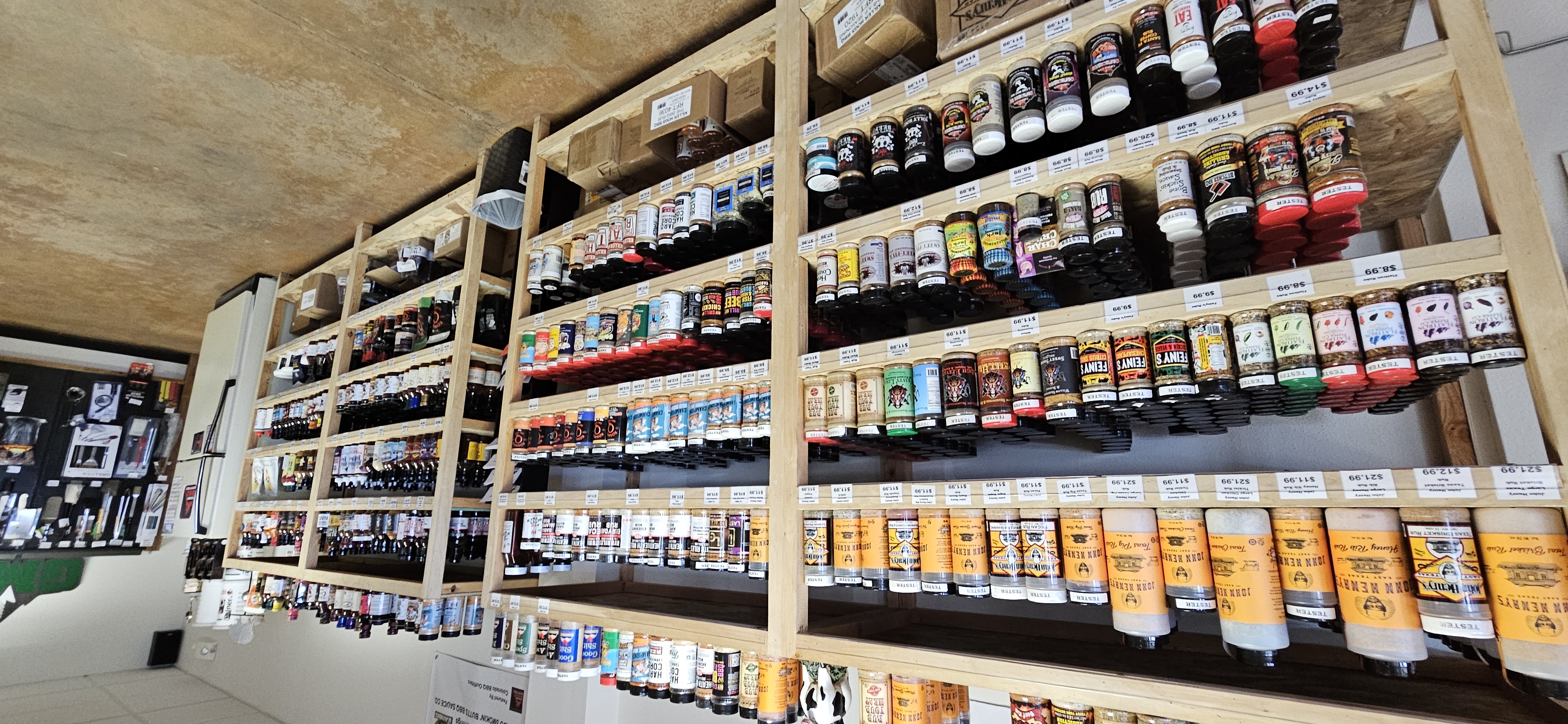 Rows of BBQ rubs and seasonings at Colorado BBQ Outfitters