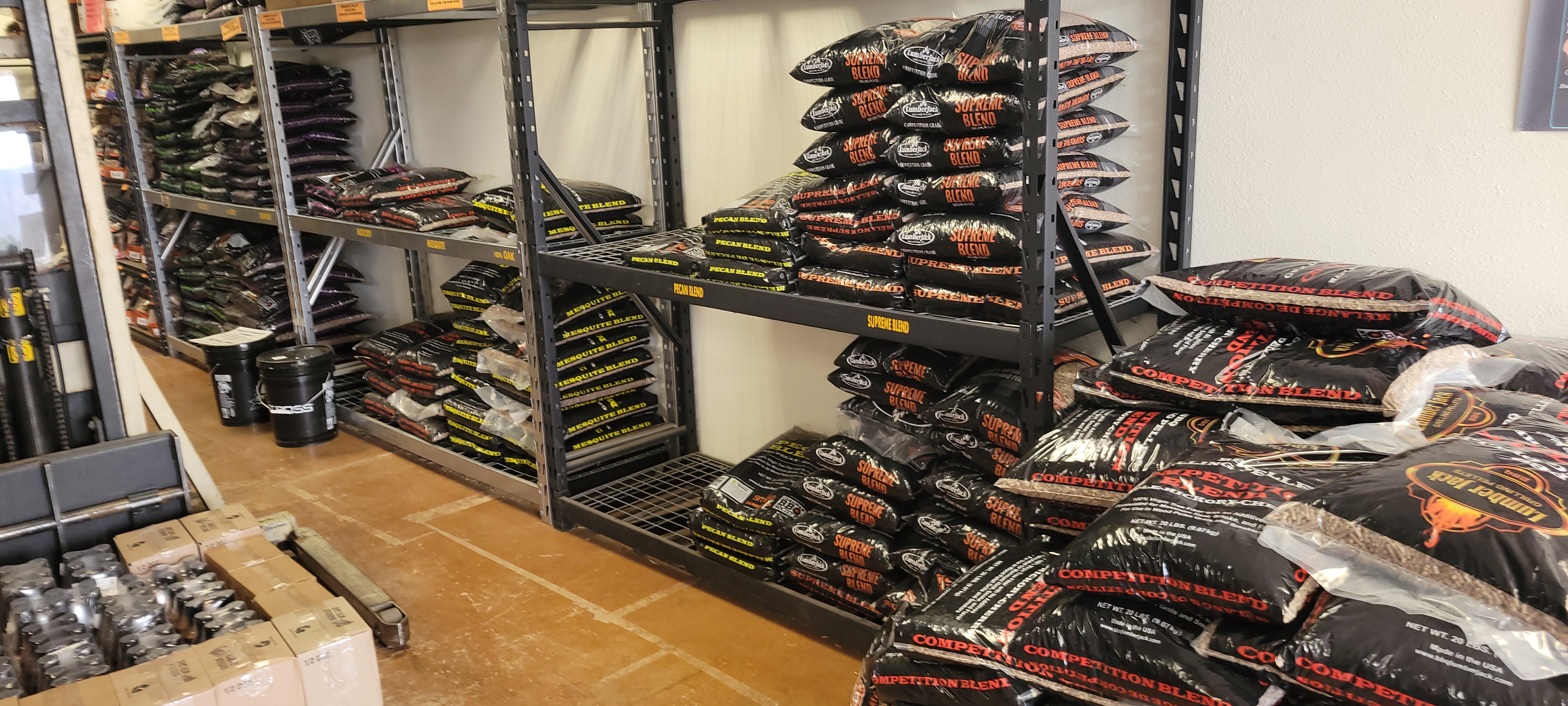 Smoking wood pellets and barbecue wood stocked at Colorado BBQ Outfitters